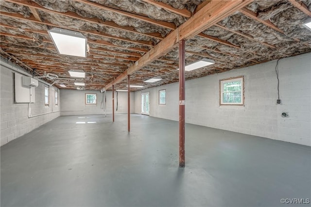 basement featuring an AC wall unit