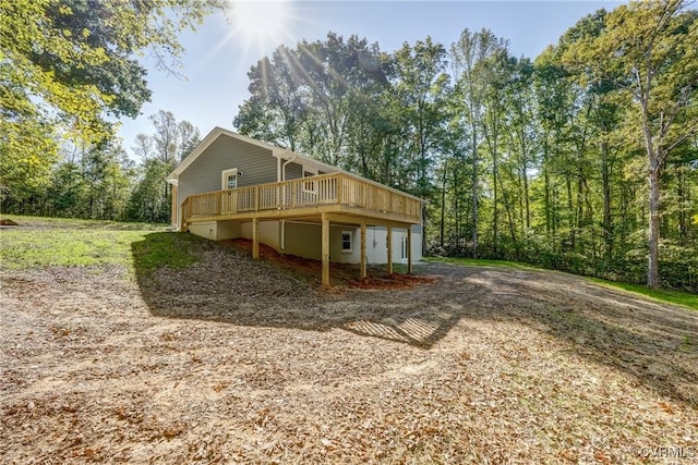 back of property featuring a deck