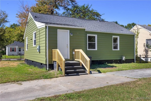 bungalow with a front yard