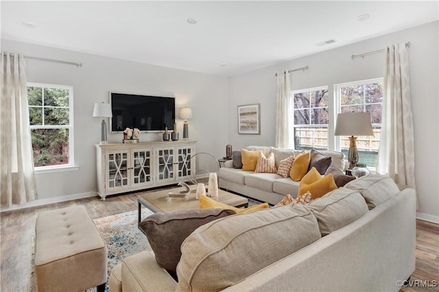 living room with light hardwood / wood-style flooring