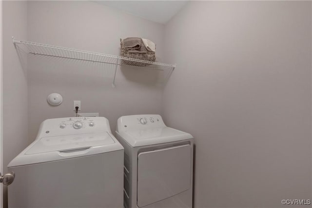 laundry area with washing machine and dryer