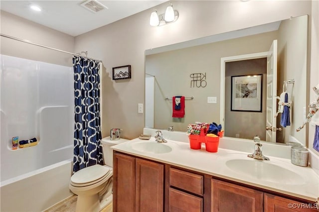 full bathroom featuring tile patterned floors, vanity, shower / tub combo, and toilet