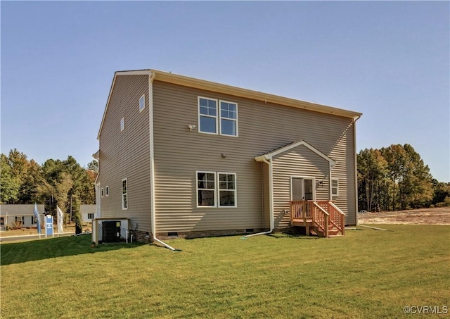 back of house with a lawn and central air condition unit