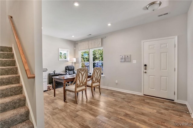 dining area with hardwood / wood-style flooring