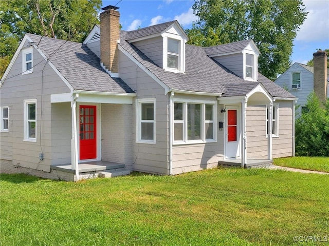 cape cod-style house featuring a front lawn