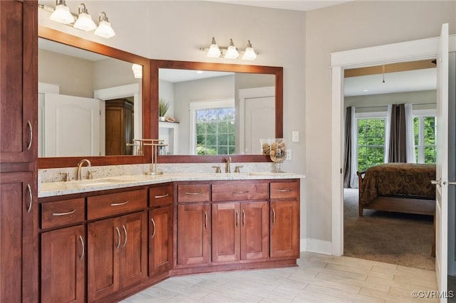 bathroom with vanity and a healthy amount of sunlight