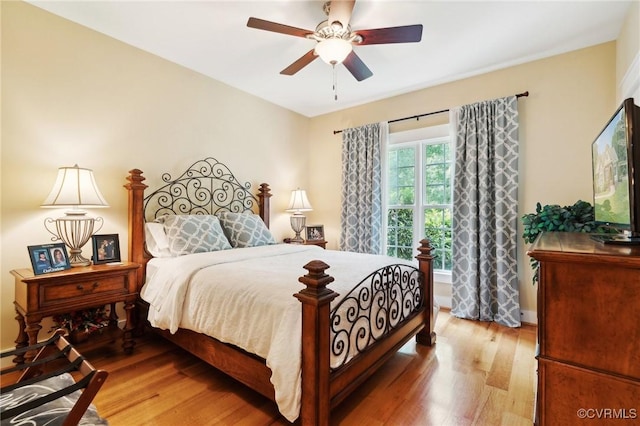 bedroom featuring hardwood / wood-style flooring and ceiling fan