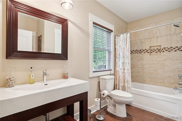 full bathroom with shower / bath combo, toilet, and sink