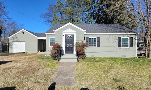 view of front of house featuring a garage and a front lawn