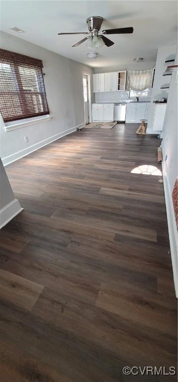 interior space with dark hardwood / wood-style floors and ceiling fan