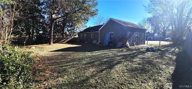 view of side of property with a lawn