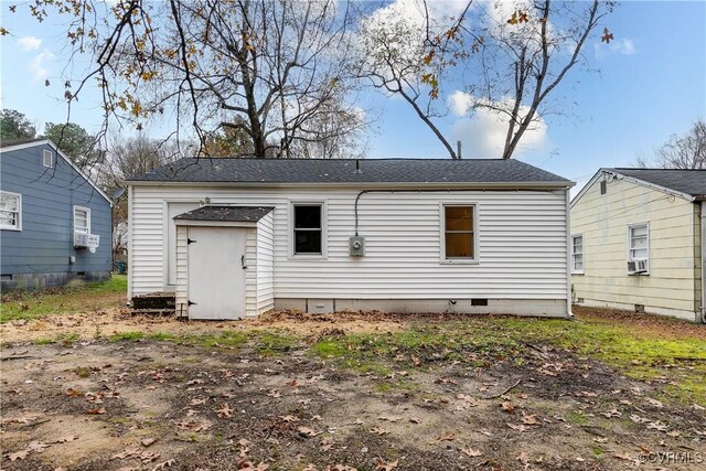 rear view of house featuring cooling unit