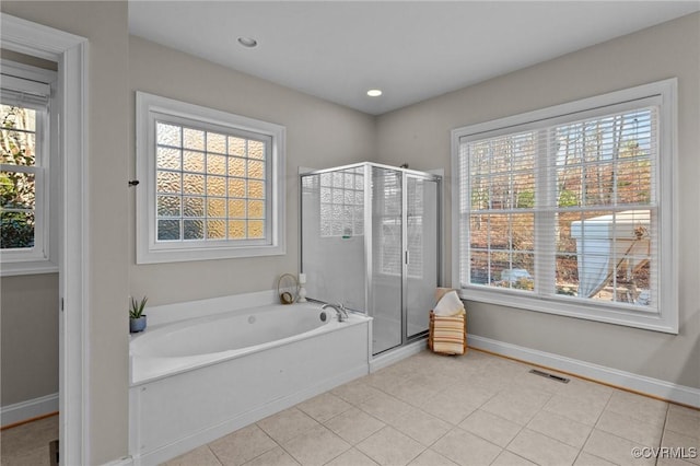 bathroom with tile patterned floors and plus walk in shower