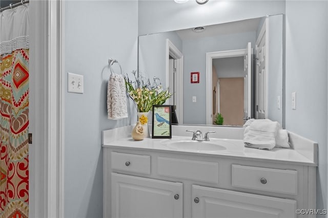 bathroom featuring vanity and walk in shower