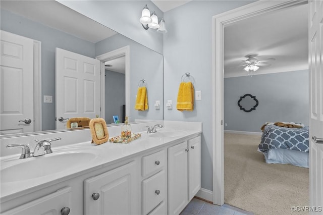 bathroom featuring ceiling fan and vanity