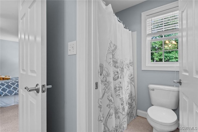 bathroom with tile patterned floors and toilet