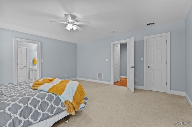 carpeted bedroom featuring ceiling fan and connected bathroom