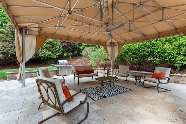 view of patio with a gazebo, an outdoor living space, and area for grilling