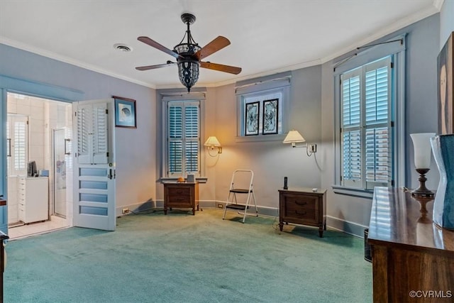 sitting room with carpet flooring, ceiling fan, and ornamental molding