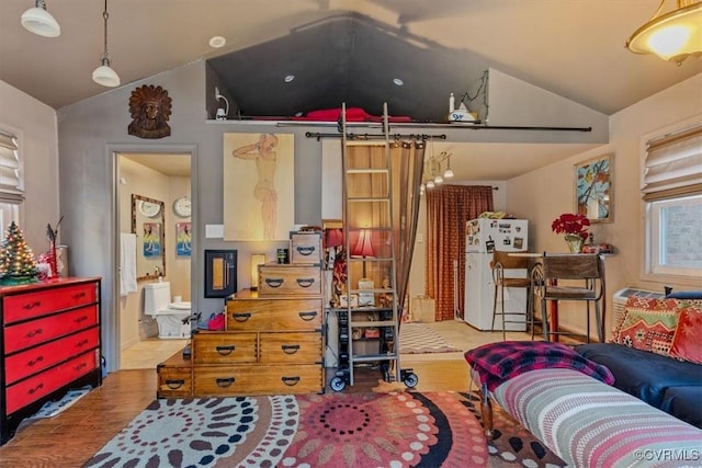 living room featuring light hardwood / wood-style floors and lofted ceiling