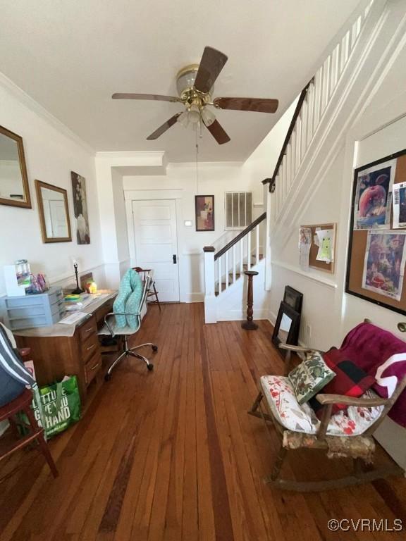 office space featuring ceiling fan, ornamental molding, and wood-type flooring