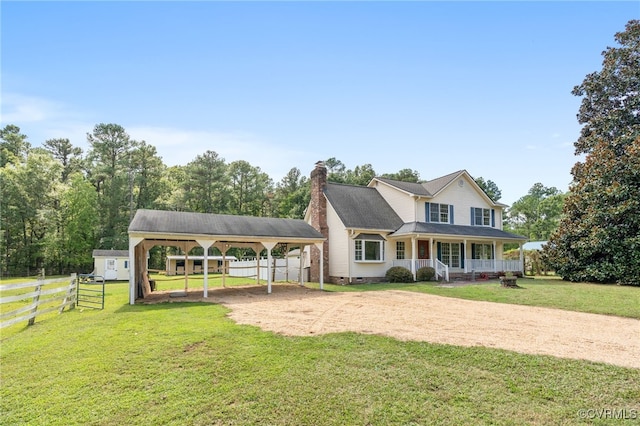 view of front facade with a porch, a carport, and a front lawn