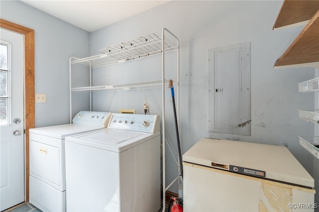 washroom featuring separate washer and dryer and electric panel