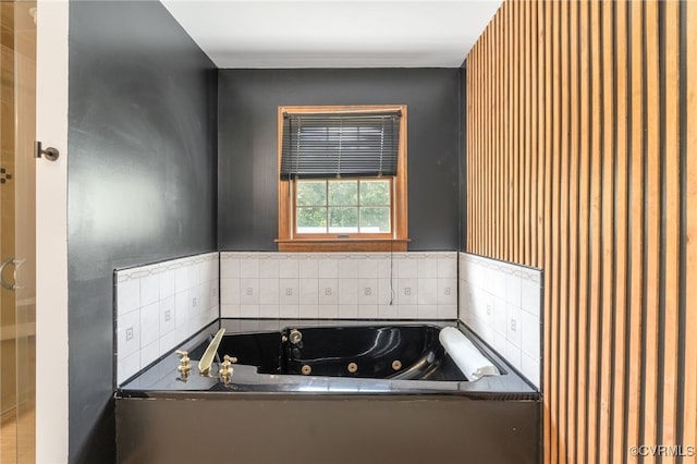 bathroom featuring tiled bath