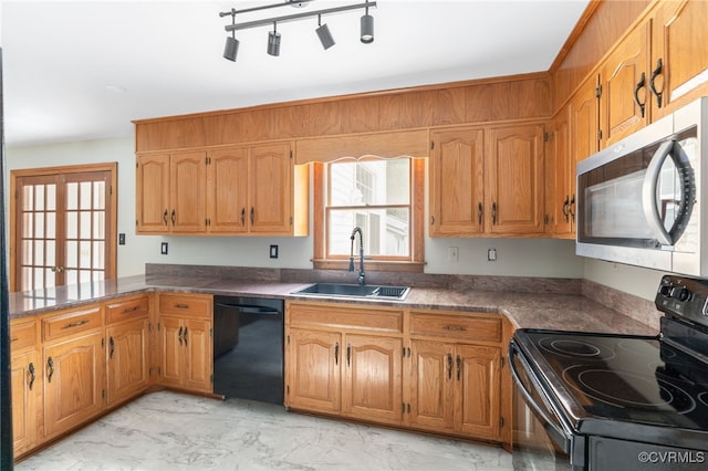 kitchen featuring sink and black appliances