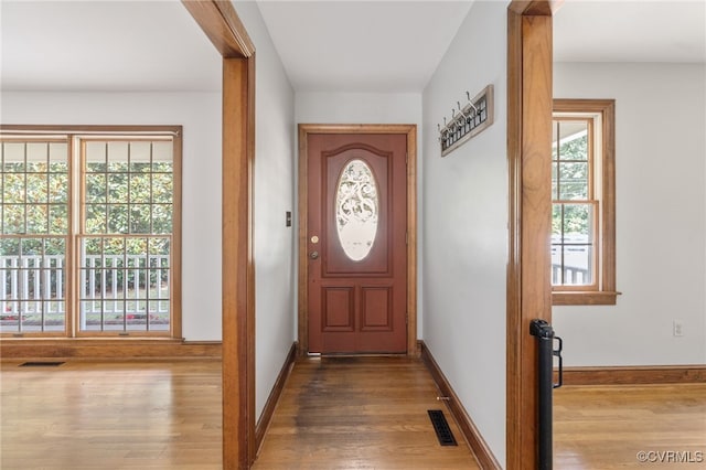 doorway to outside with hardwood / wood-style floors