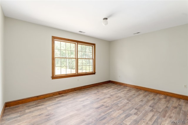 unfurnished room featuring light hardwood / wood-style flooring