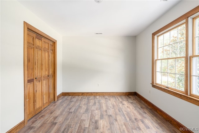 unfurnished room featuring wood-type flooring