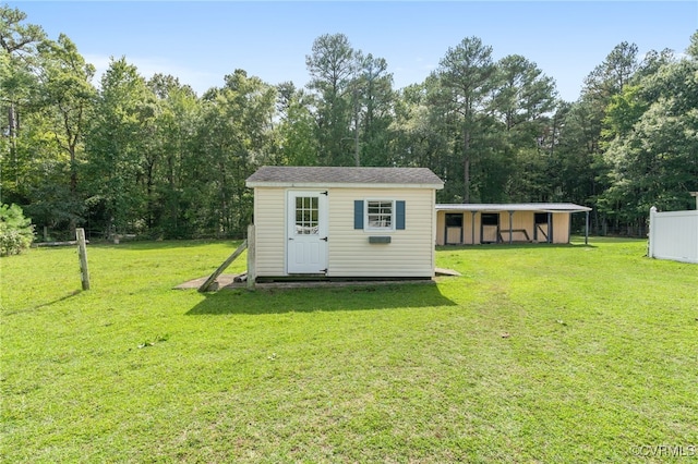 view of outbuilding with a lawn