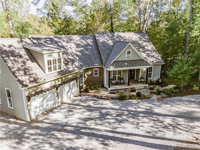 view of front of home with covered porch and a garage