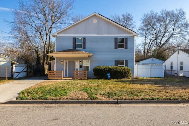 view of front property featuring a front lawn and covered porch