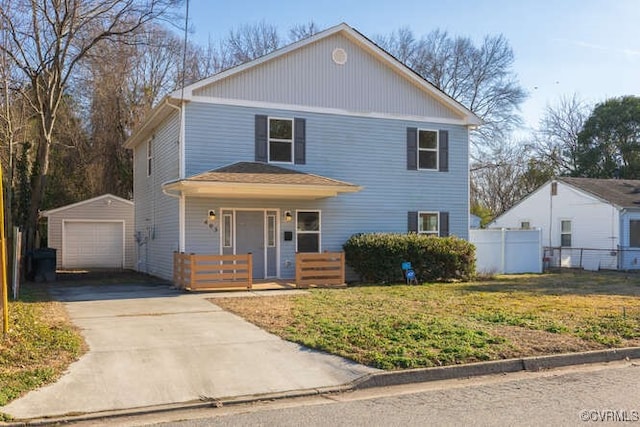 front of property featuring a garage, an outdoor structure, covered porch, and a front lawn