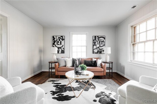 living room with a wealth of natural light and dark hardwood / wood-style floors