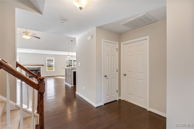 corridor featuring dark wood-type flooring