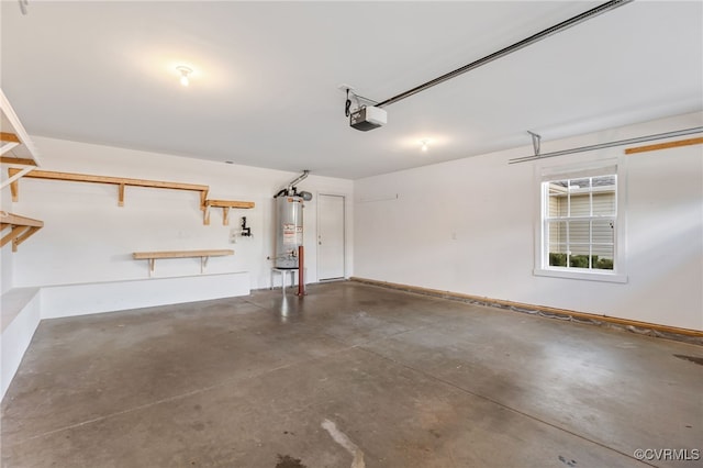 garage featuring water heater and a garage door opener