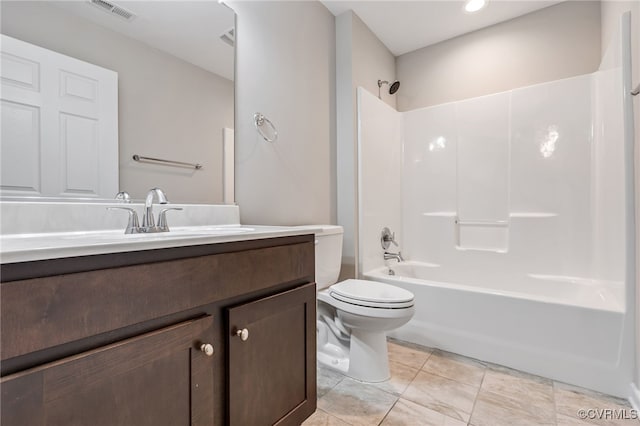 full bathroom featuring toilet, vanity, and  shower combination