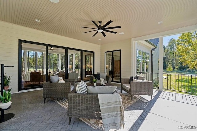 view of patio featuring outdoor lounge area and ceiling fan