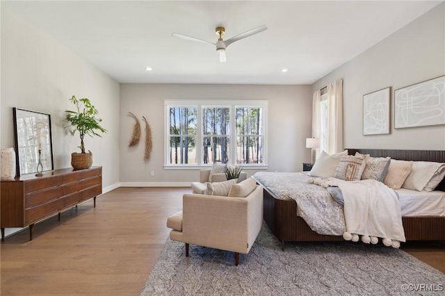 bedroom featuring ceiling fan and wood-type flooring