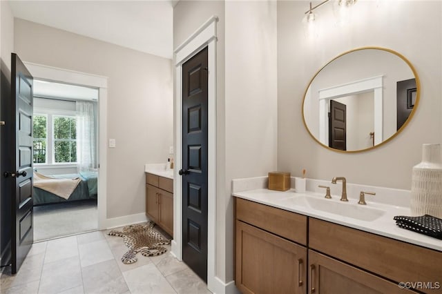 bathroom featuring tile patterned floors and vanity