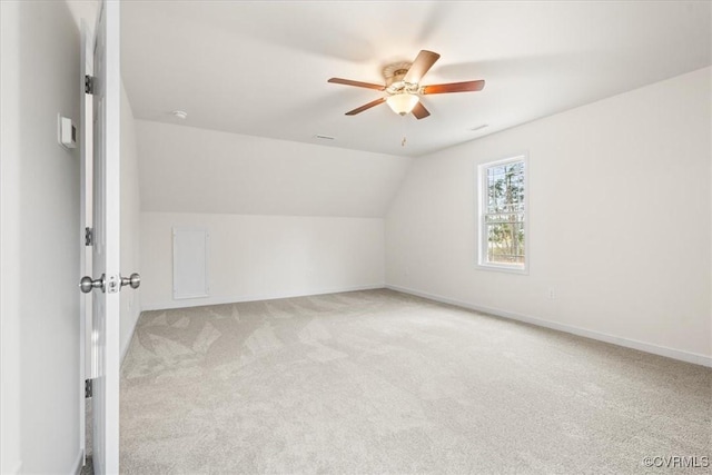 additional living space with light carpet, ceiling fan, and lofted ceiling