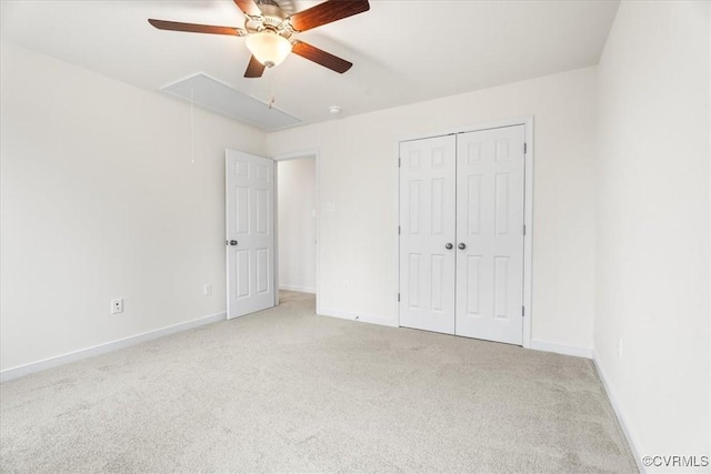 unfurnished bedroom with light carpet, a closet, and ceiling fan