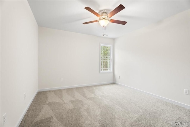 empty room featuring light carpet and ceiling fan