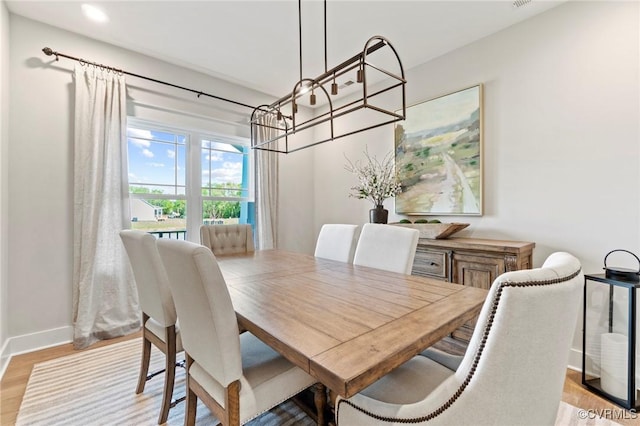 dining area with light hardwood / wood-style floors