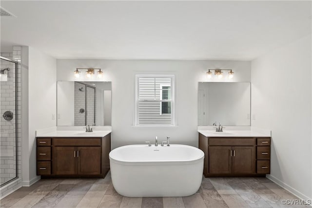 bathroom featuring vanity and plus walk in shower