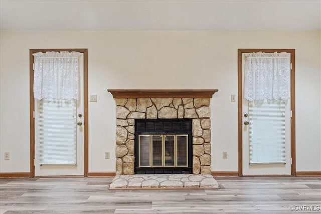 details with a fireplace and wood-type flooring