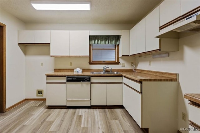 kitchen featuring a textured ceiling, white dishwasher, sink, light hardwood / wood-style floors, and white cabinetry